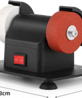 Compact Bench Top Grinder With Rock Solid Base Dual Sharpening Wheels showing white and red grinding wheels on a black frame.