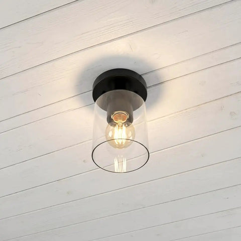 Industrial Semi Flush Mount Ceiling Light With Cylinder Glass Shade And E26 Base installed on white ceiling
