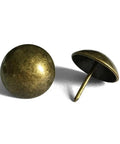Top Drawer Vintage Brass Upholstery Tacks For Sofas And Headboards One Inch Round decorative furniture nails shown in close-up.