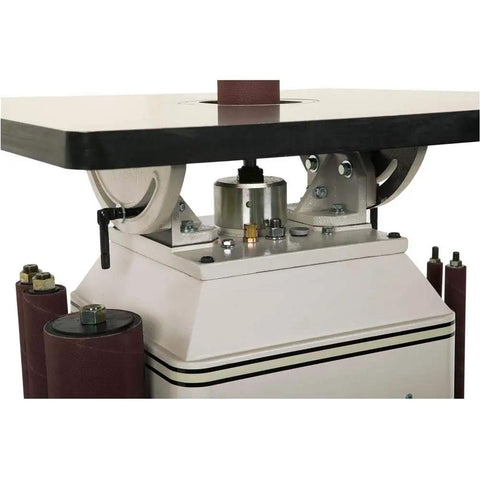 Powerful One Horsepower Oscillating Spindle Sander Featuring Rock Solid Cast Iron Table And Roomy Four Inch Dust Port For Knockout Smooth Finishes And Easy Cleanup Every Time - close-up view of the motor and cast iron table.