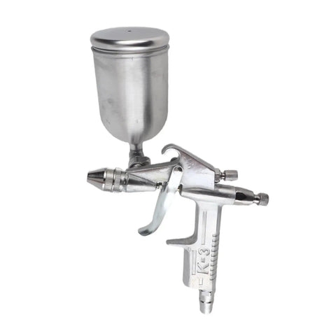 Top Notch Mini Pneumatic Spray Gun Featuring A Butter Smooth 0.5mm Nozzle Effortless Fine Mist Atomization For Auto Detailing Craft Projects Lightweight Handheld Design Shows metal structure and precision nozzle.
