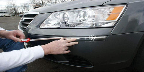 Installed Cowles Custom chrome body molding on gray car bumper; 1/2 in x 18 ft flexible PVC