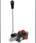 Front view of hydraulic flow control valve with long chrome lever, black knob, and red port caps.