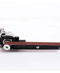 Close-up of Knockout Mini Belt Sander Adapter mounted on an angle grinder for quick deburring and polishing tasks.