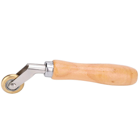 Side view of wooden-handle seam roller with metal head and brass wheel for roofing membrane work