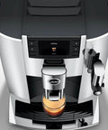Level Up Your Daily Grind With This Sleek Chrome Automatic Coffee Machine Boasting One Touch Operation Built In Grinder And Rich Foam Frother For A Real Deal Barista Experience Certified Refurbished top view of sleek chrome coffee machine with digital display and brewed coffee.