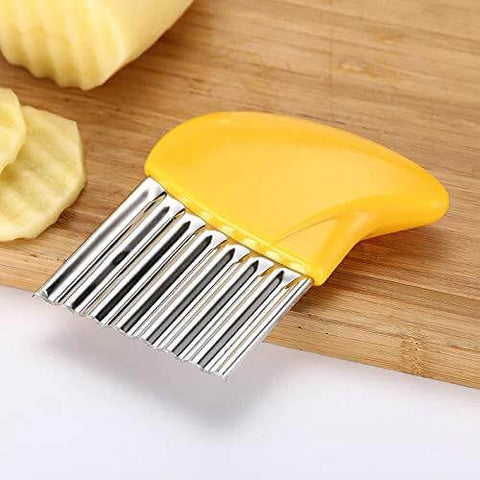 Close-up of yellow-handled crinkle-cut vegetable knife with stainless-steel wavy blade.