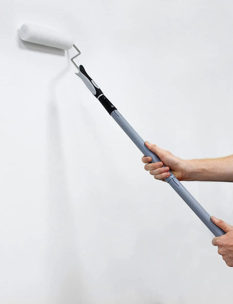 Person using 10 Piece Paint Roller Kit With 9 Inch Rollers Tray Extendable Poles Angled Brush Extra Roller Covers Can Opener Stir Bar