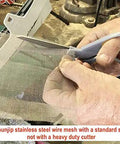 Person cutting stainless steel reinforcing mesh for thermoplastic bumper and kayak repairs, 5x8.75 inch, 2 pack, with scissors.