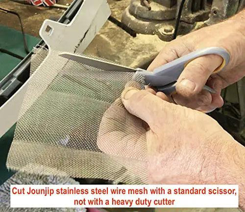Person cutting stainless steel reinforcing mesh for thermoplastic bumper and kayak repairs, 5x8.75 inch, 2 pack, with scissors.
