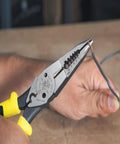 Workhorse Needle Nose Pliers with long reach for crimping, cutting, stripping wire, dual material handles in use