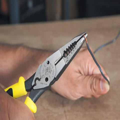 Workhorse Needle Nose Pliers with long reach for crimping, cutting, stripping wire, dual material handles in use