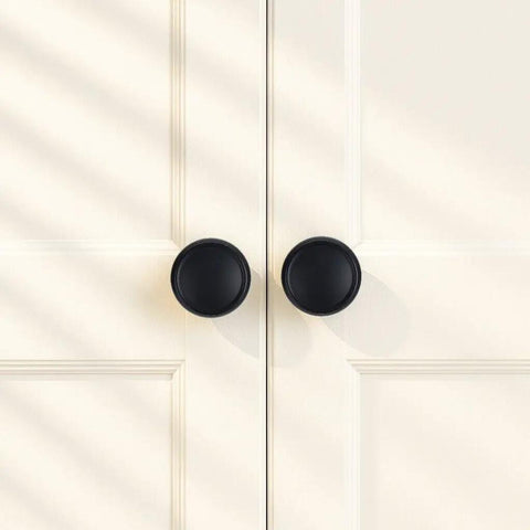 10 Pack Matte Black Cabinet Knobs 1-1/4 Inch Modern Zinc Alloy Hardware for Kitchen Cabinets on white cupboard.