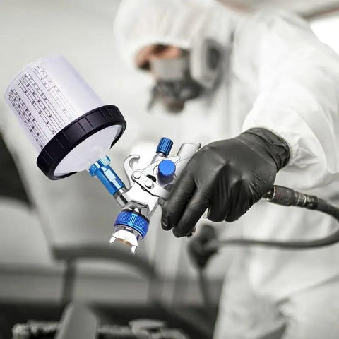 Badass Pneumatic Paint Spray Gun Kits With Slick High Atomization And Heavy Duty No Clean Cups Plus Adjustable Air Pressure Regulator and Shop Ready Spraying Tools In Solid Green Palette, close-up of spray gun and cup.