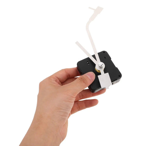 Hand holding Vinyl Record Clock Mechanism Replacement Kit with precise timekeeping and durable hands for easy DIY repair and home decor.