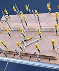 Matchfit Dovetail Clamps Set With Soft Grip Handles Two Piece Two Pack For Precise Routing Fences on a workbench.