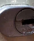 Close-up of an S110 core lock for desk drawers, compatible with Heavy Duty Office Cabinet Replacement Key For S110 Core Fits Desk Drawers And Modular Cubicle Locks Genuine Oem Brass Hardware No Fuss Setup Slides Like A Charm For Daily Grind Use.