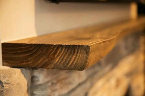 Top Shelf Golden Oak Reactive Wood Stain on a rustic wooden mantel, highlighting rich amber tones and natural grain detail.