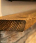Golden Oak Reactive Interior Wood Stain 55 Gallon Drum Voc Free Water Based Finish on a wooden shelf edge with brown tones.
