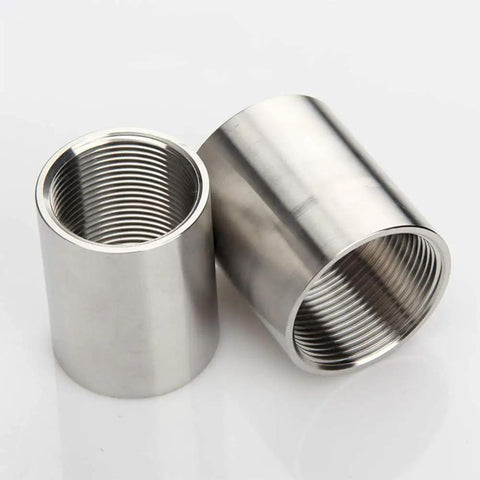 304 Stainless Steel Cast Pipe Coupling Fitting With One Half Inch NPT Female Threads And Polished Finish Workhorse For Plumbing And Industrial Use One Inch Length High Temperature Tolerance And Low Magnetic Permeability, two couplings shown