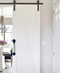 White barn door with industrial style wrought iron cabinet and barn door handles with hemp rope pulls, retro European antique look.