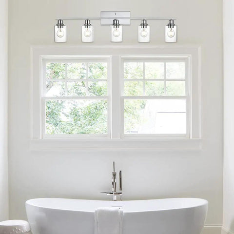 Five Light Chrome Vanity Fixture With Clear Cylinder Glass Shades For Bathroom Hallways And Staircases Modern Indoor Wall Sconce Lighting For Entryways Chic Contemporary Design With Bright Ambient Glow above bathtub in bathroom