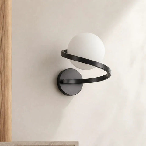 MAHGNTKCX Black Wall Sconce with Opal Glass Globe and Spiral Metal Frame showcasing the sculptural spiral design.