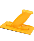 Bright yellow Built Tough As Nails Woodworking Push Block with ergonomic handle, designed for safe table saw operations.