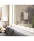 Mad Fast Instant Hot Water Flow Beige Natural Gas Tankless Water Heater mounted on the outside wall beside a cozy living room.