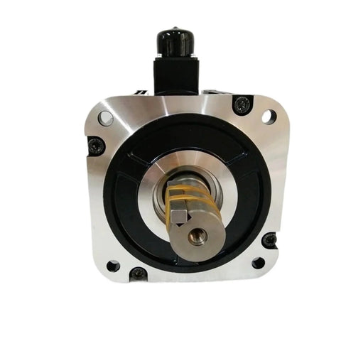 Front view of an AC servo motor with square mounting flange, silver body, and exposed central shaft.