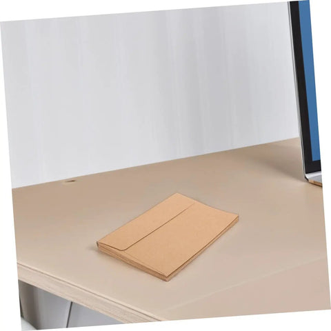 Stack of 60 Pack Kraft Paper Self-Seal Envelopes, Letter Size 10.8 X 15.9 Cm, Writable For Wedding Invitations, Dope Rustic Look on a desk