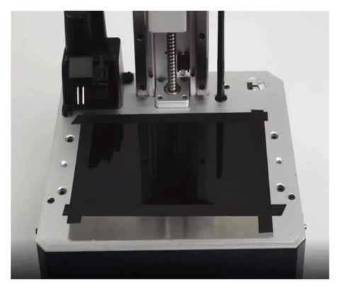 Heavy Duty Black Shading Tape For 3D Printers applied on resin printer build platform to block light leaks and enhance print quality.
