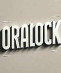 Wall-mounted 3D sign with bold white letters spelling ORALOCK