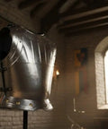 Epic Medieval Warrior Breastplate Armor Fitted Metallic Chest Plate One Size Rustic Vintage in a medieval-themed room.