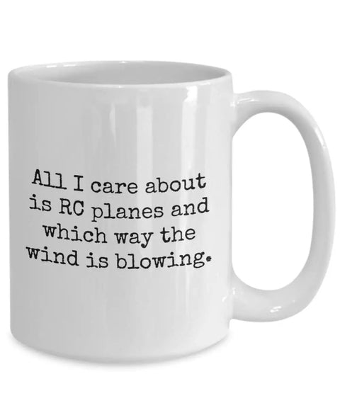 White ceramic mug with text 'All I care about is RC planes and which way the wind is blowing.'