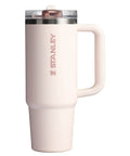 Solid Double Wall Vacuum Insulated Flip Straw Travel Tumbler With Secure Leakproof Lid Keeps Drinks Ice Cold All Day Long Rose Quartz Thirty Ounce Portable Cup For Gym Hiking And Daily Grind in rose quartz color with ergonomic handle.
