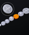 Seven Piece Dope Plastic Pulley Kit For DIY Belts And Model Making, 2A 2B Shaft Fit, white and orange plastic pulleys on black background