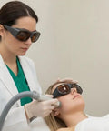 Top Shelf OD7 Laser Protection Safety Glasses For 532nm 755nm 1064nm worn by clinician during laser treatment on client.