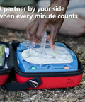 AED defibrillator Fast Response Kit in blue case with mask, outdoor setting