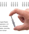 Hand holding plastic expansion anchor from Heavy Duty Shade Sail Hardware Kit For Rectangle And Square Sails, 5 Foot Installation, Marine Grade 304 Stainless Steel, Includes Turnbuckles Pad Eyes Snap Hooks Screws And All Essential Hardware For Deck Garden And Patio.