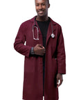 Unisex Burgundy 39 Inch Lab Coat With Two Large Patch Pockets, Two Inner Pockets And Chest Pocket, Adjustable Back Belt, Walking Slit, And Side Vents, Durable Professional Coat For Nurses And Doctors worn by model.