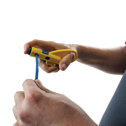 Person using Data And Coax Cable Stripping Tool with Radial Design for RG59 RG6 and CAT3 to CAT6A, adjusting high carbon steel blades.
