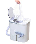 Hand Crank Washing Machine With Biomimetic Scrub Interior Manual Portable Laundry Soaker lifting a shirt, suitable for camping.