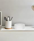 Slick Heavy Duty Double Sided Tape For Quick Fixes And Secure Mounting Reusable Transparent Adhesive Roll on desk next to office supplies.