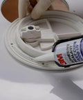 Applying Marine Adhesive 4000 UV PN06580 White sealant on boat hatch, medium-strength waterproof sealant, 295 mL cartridge.