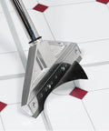Adjustable Eight Inch Floor Stripper With Telescoping Handle from three to six feet on tile floor, 15-degree angled blade visible