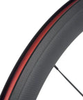 Close-up of 50mm carbon fiber track wheel set matte finish 3K fixed gear wheelset with cog built for speed junkies and long rides.