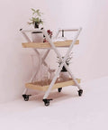Tough As Nails Steel Rolling Cart With Tempered Glass Top For Kitchen Wine Storage Bar Serving Hella Spacious Three Tier Drink Trolley, featuring plants and glassware.