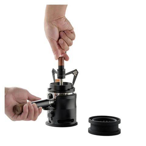 Hand using solid wood tamper on black espresso tool in Snag This Knockout Espresso Coffee Tool Set For A Locked In Perfect Pull.