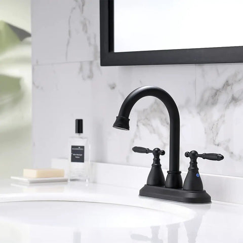 Matte Black 4 Inch Center Set Bathroom Faucet With 2 Handles, 360 Degree Swivel Spout, Vintage Vanity Style, on white sink